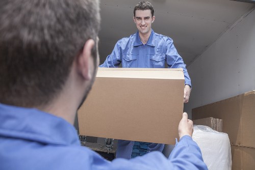 Professional movers handling IT equipment during a commercial move