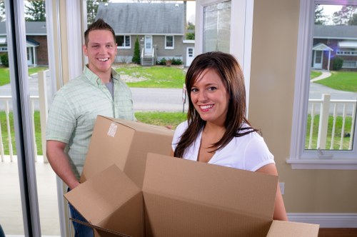 Unpacking service arranging boxes in a Bloomsbury home