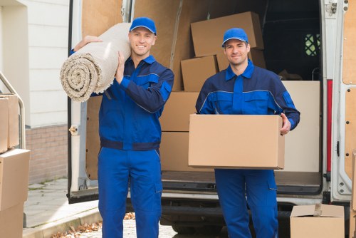 Careful loading of household furniture into a moving van