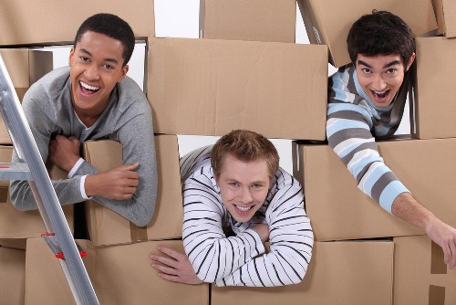 Packed boxes and furniture loaded securely into a removal truck