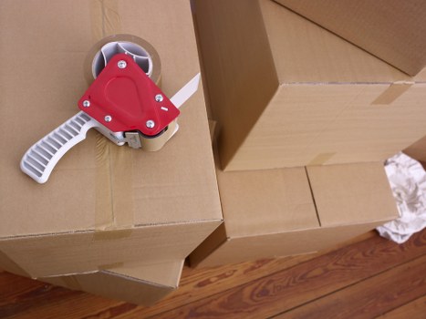 Loading household items into a van during a Bloomsbury move