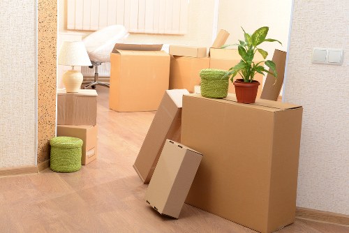 Removal team handling household items in a central London property